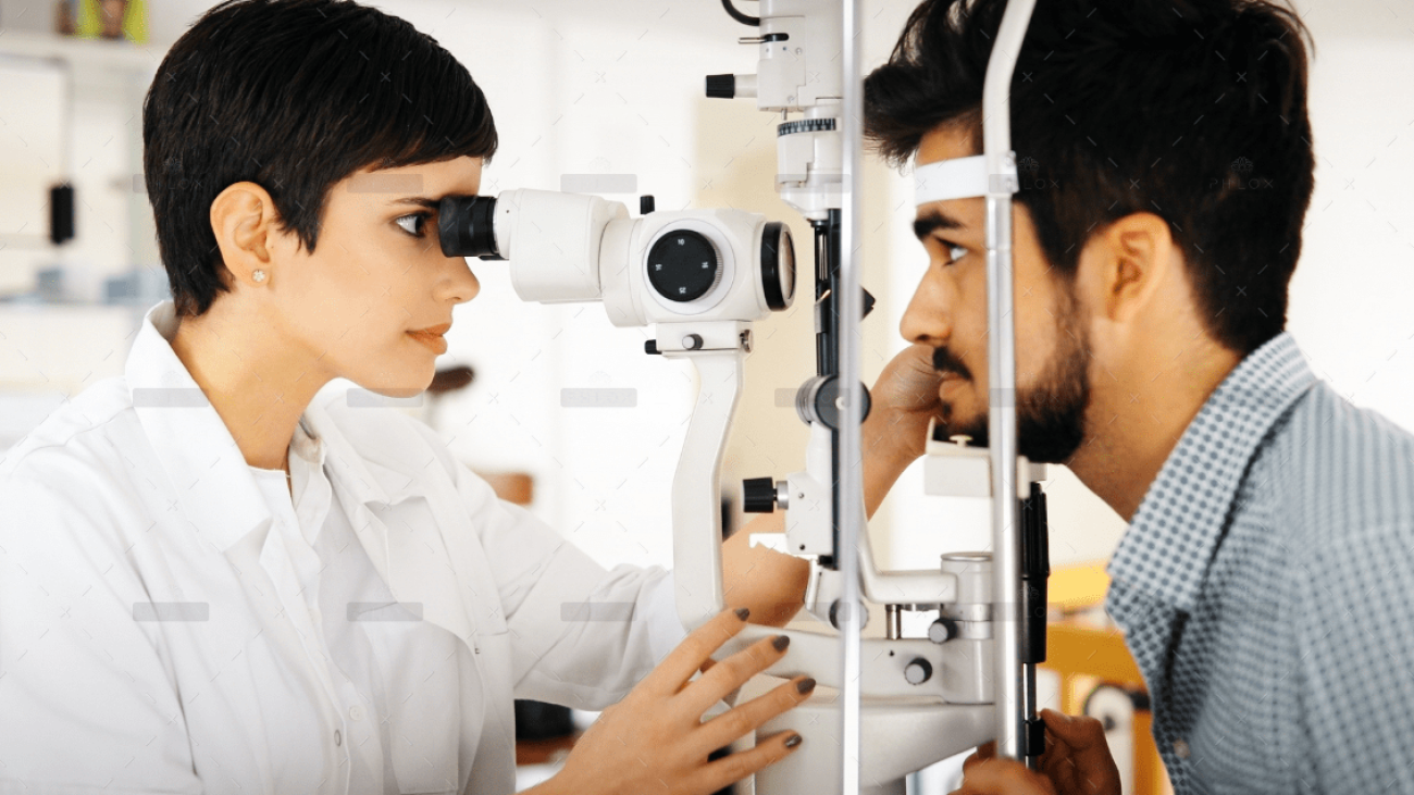 demo-attachment-1398-optometrist-examining-patient-in-modern-RXUVD5T